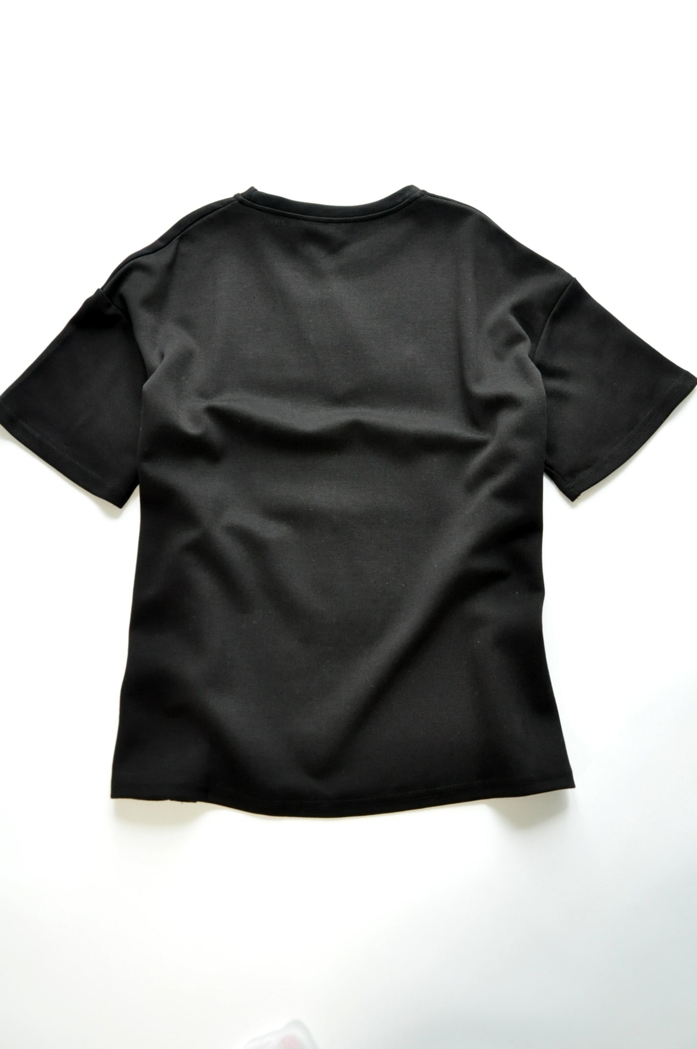 Black oversized graphic t-shirt embellished with sequin