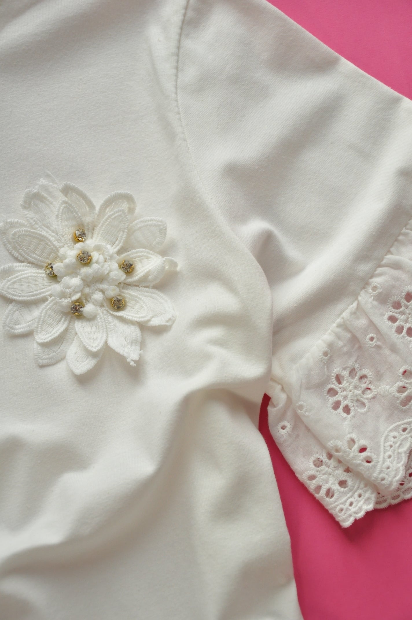 Off white broderie anglaise frilled peplum tee with 3D gem flower detail