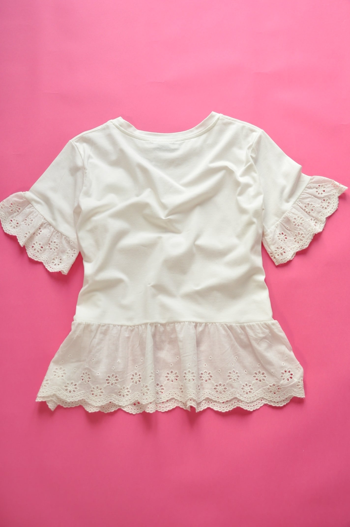 Off white broderie anglaise frilled peplum tee with 3D gem flower detail