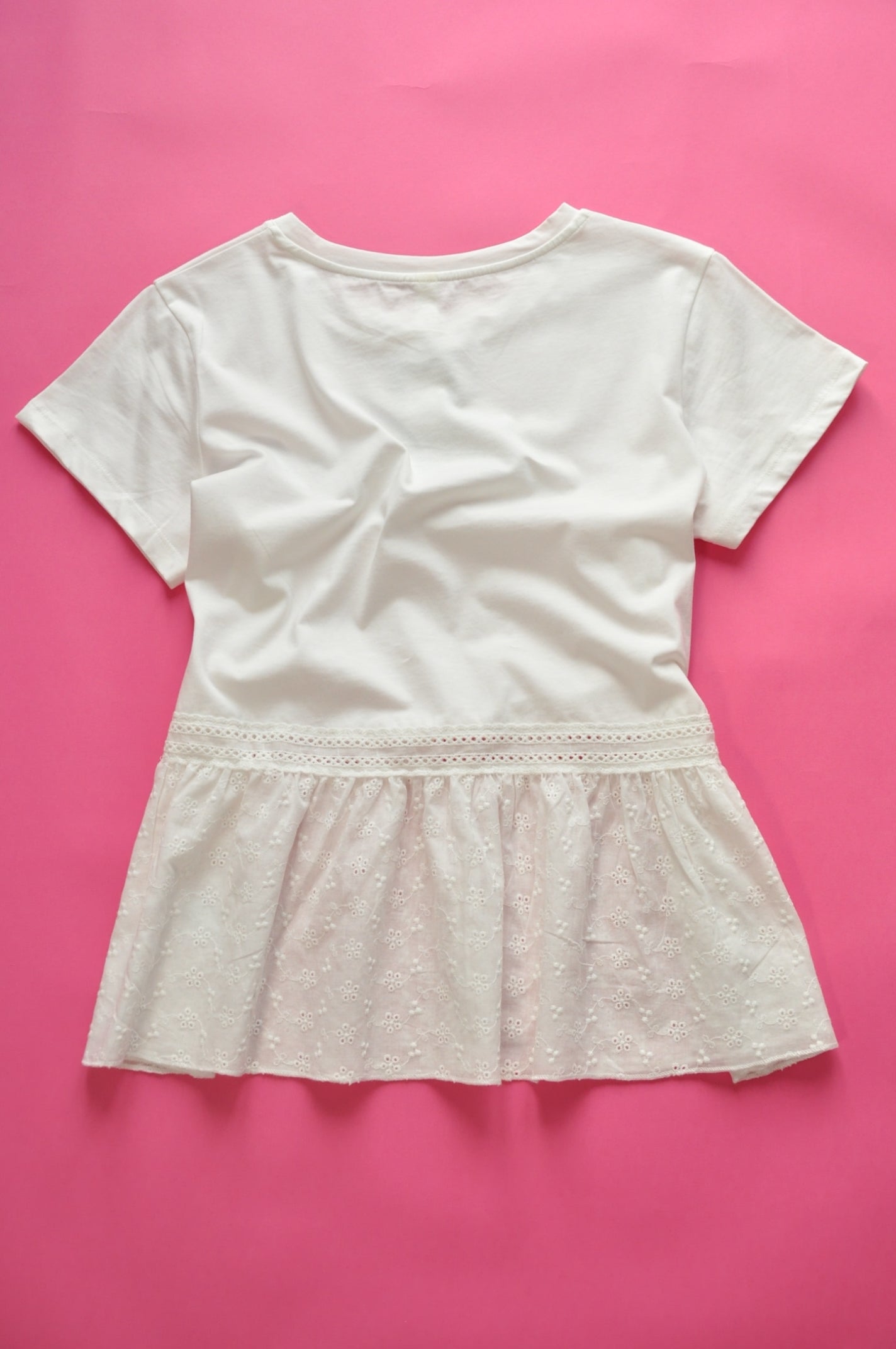 White peplum t-shirt with gleaming silver accent