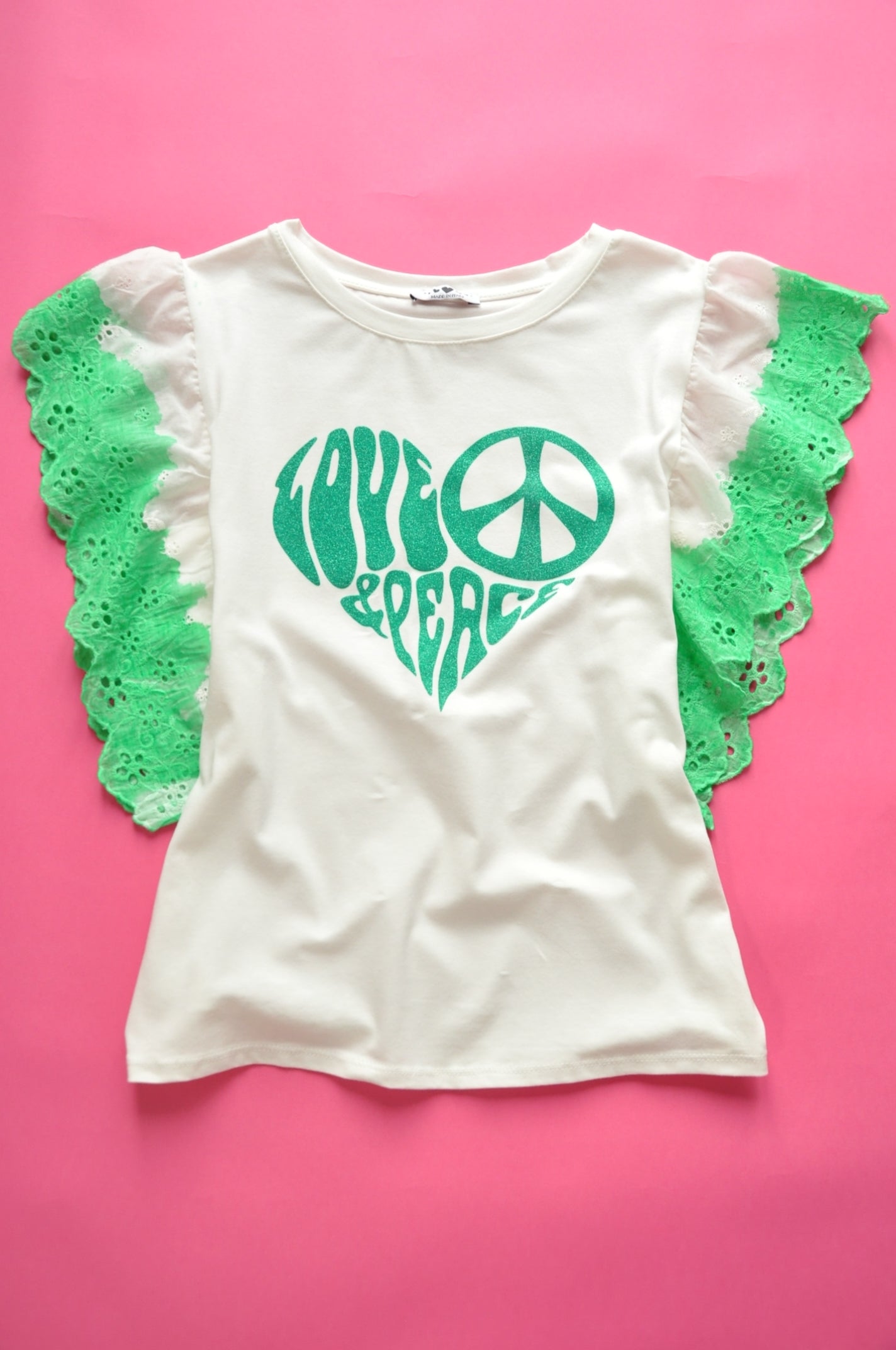 White straight-cut t-shirt with brocade green heart detail and frilled sleeves