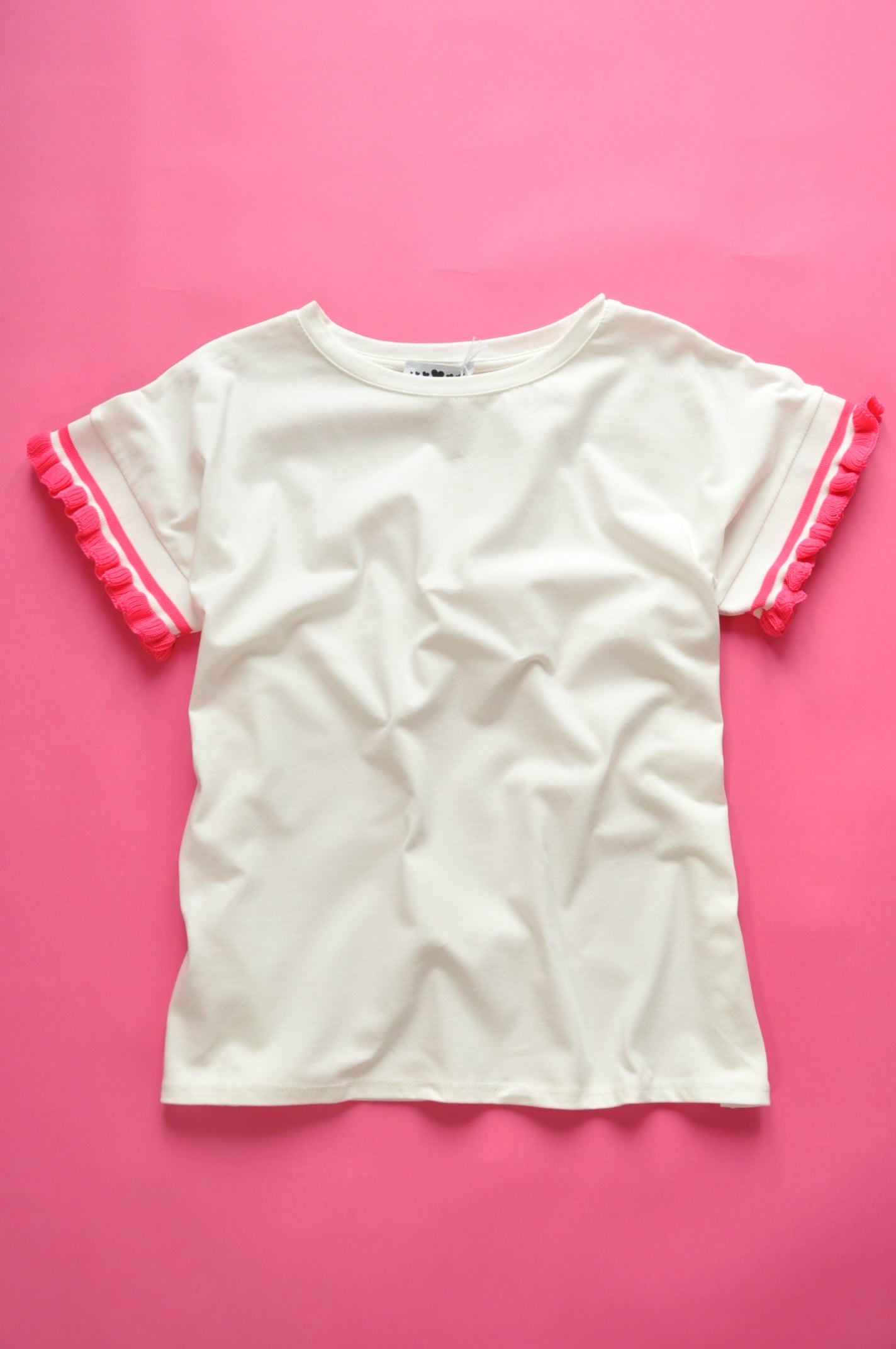 Cream soft cotton tee with pink knit frill sleeves