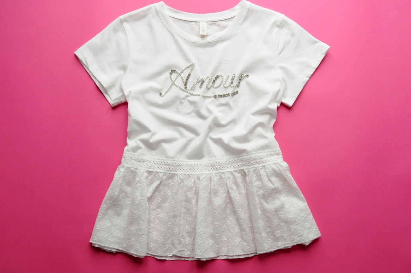 White peplum t-shirt with gleaming silver accent