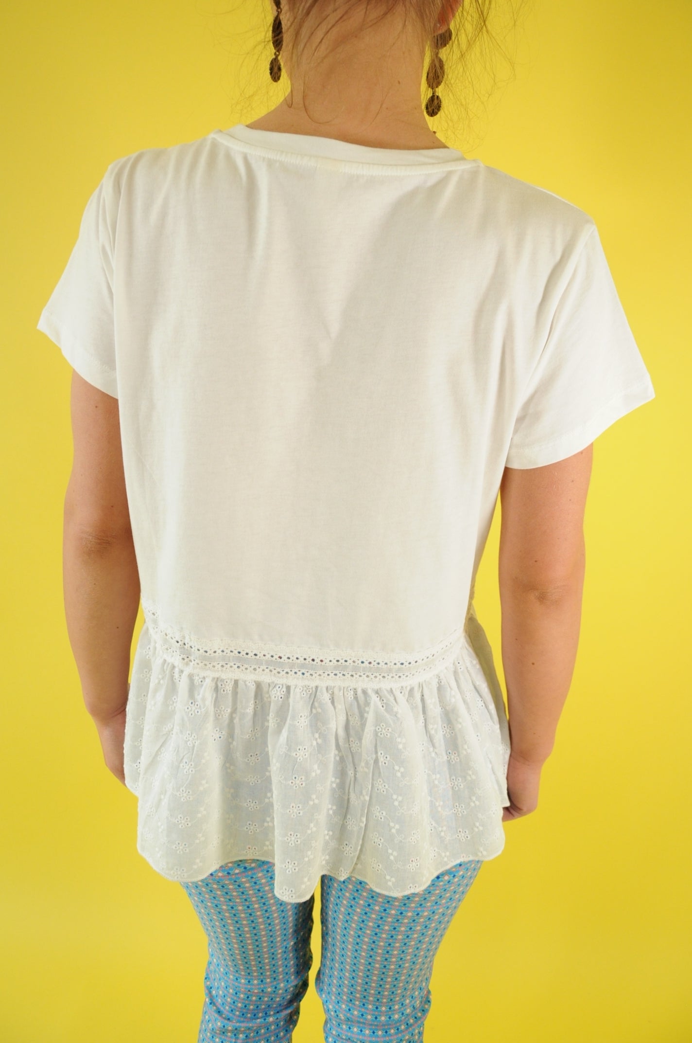 White peplum t-shirt with gleaming silver accent