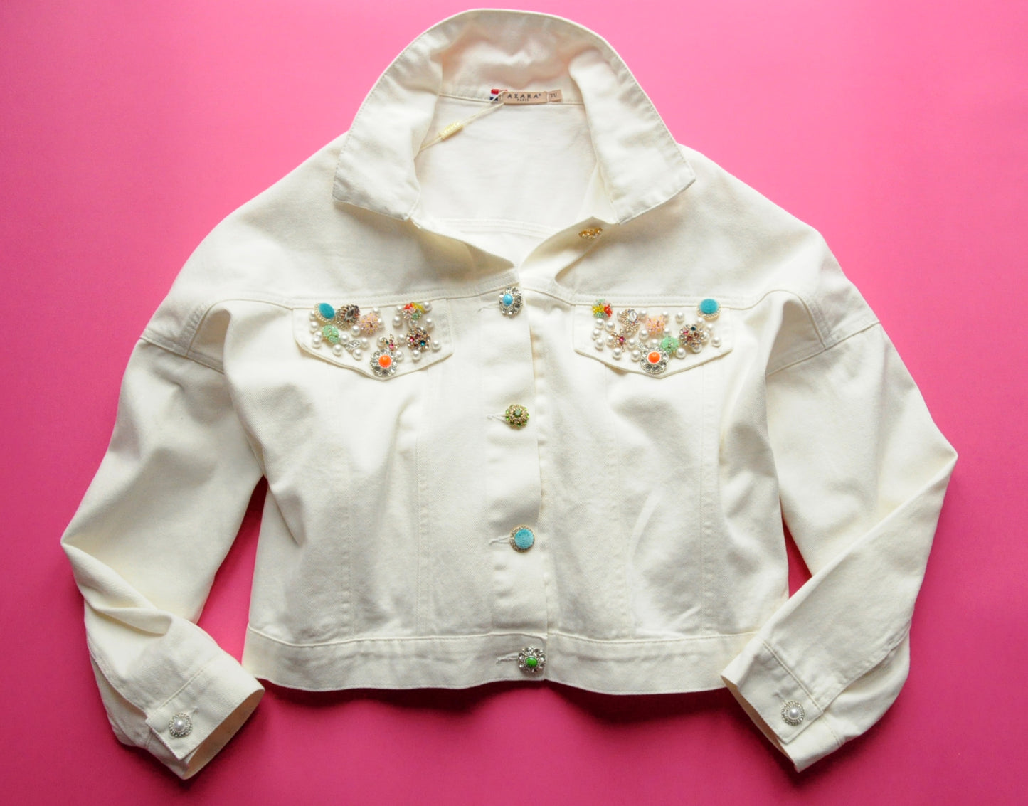 Embellished-button cropped cream denim jacket