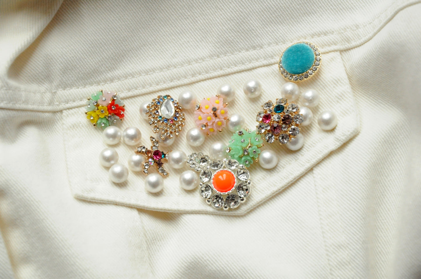 Embellished-button cropped cream denim jacket