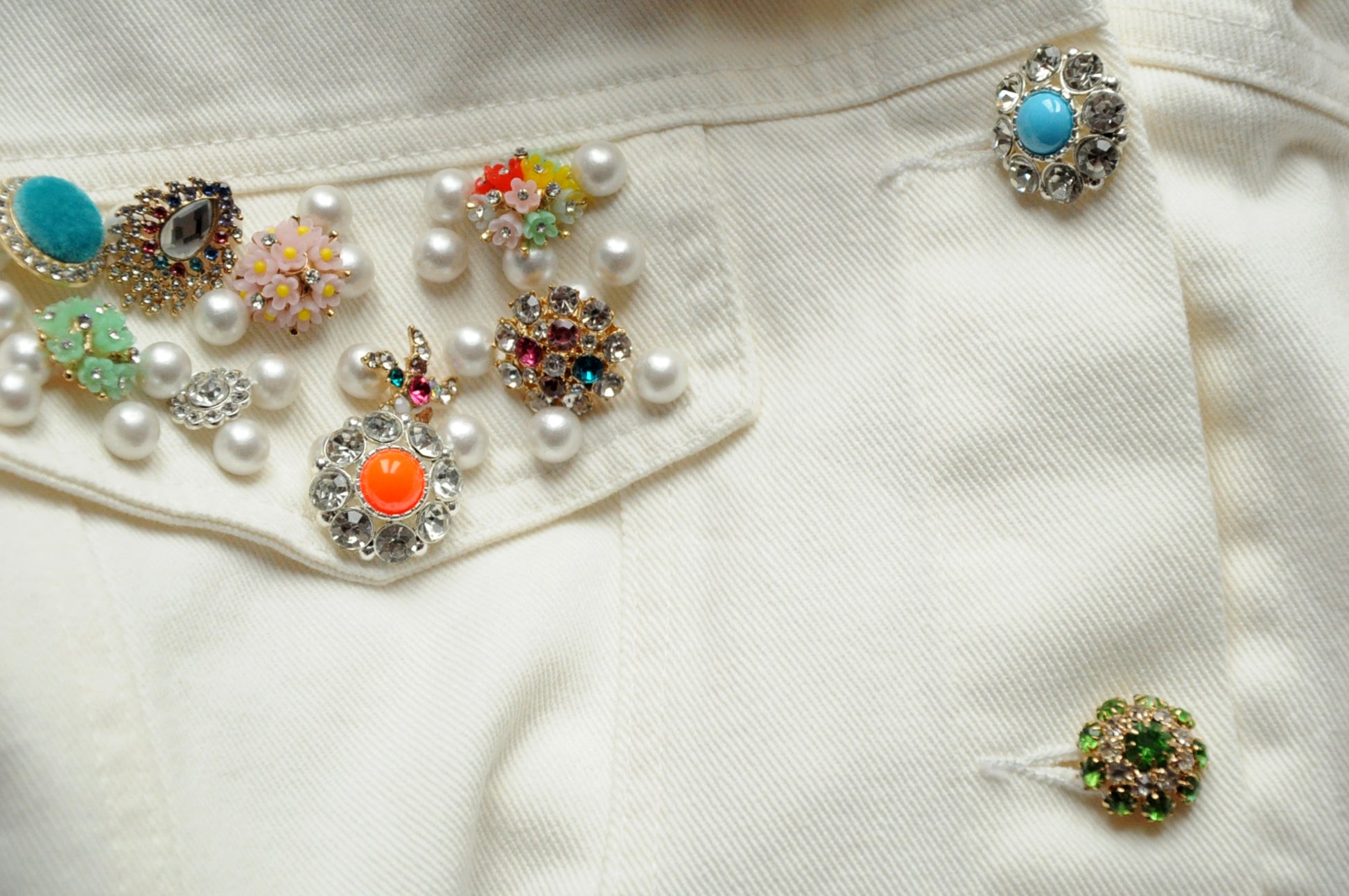 Embellished-button cropped cream denim jacket