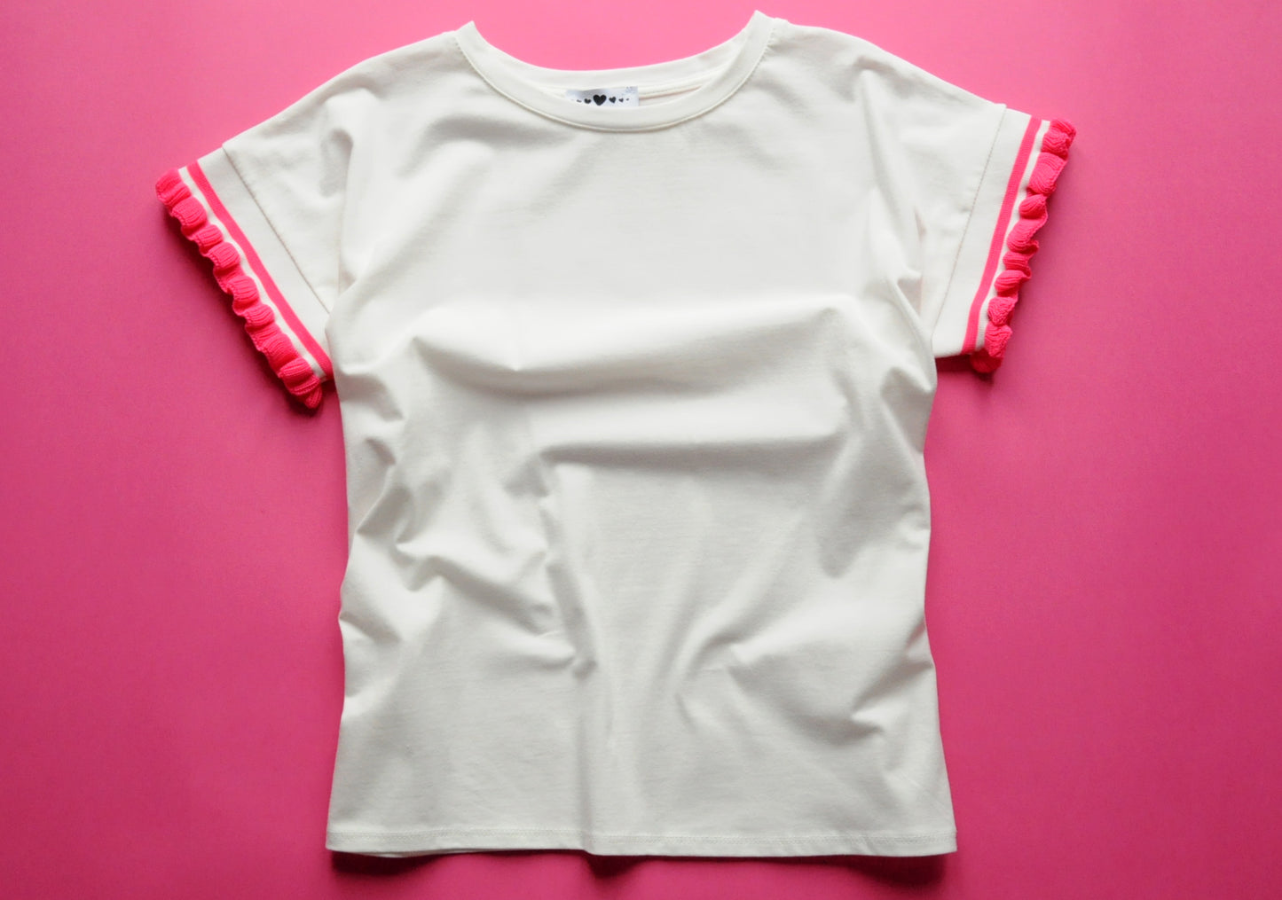 Cream soft cotton tee with pink knit frill sleeves