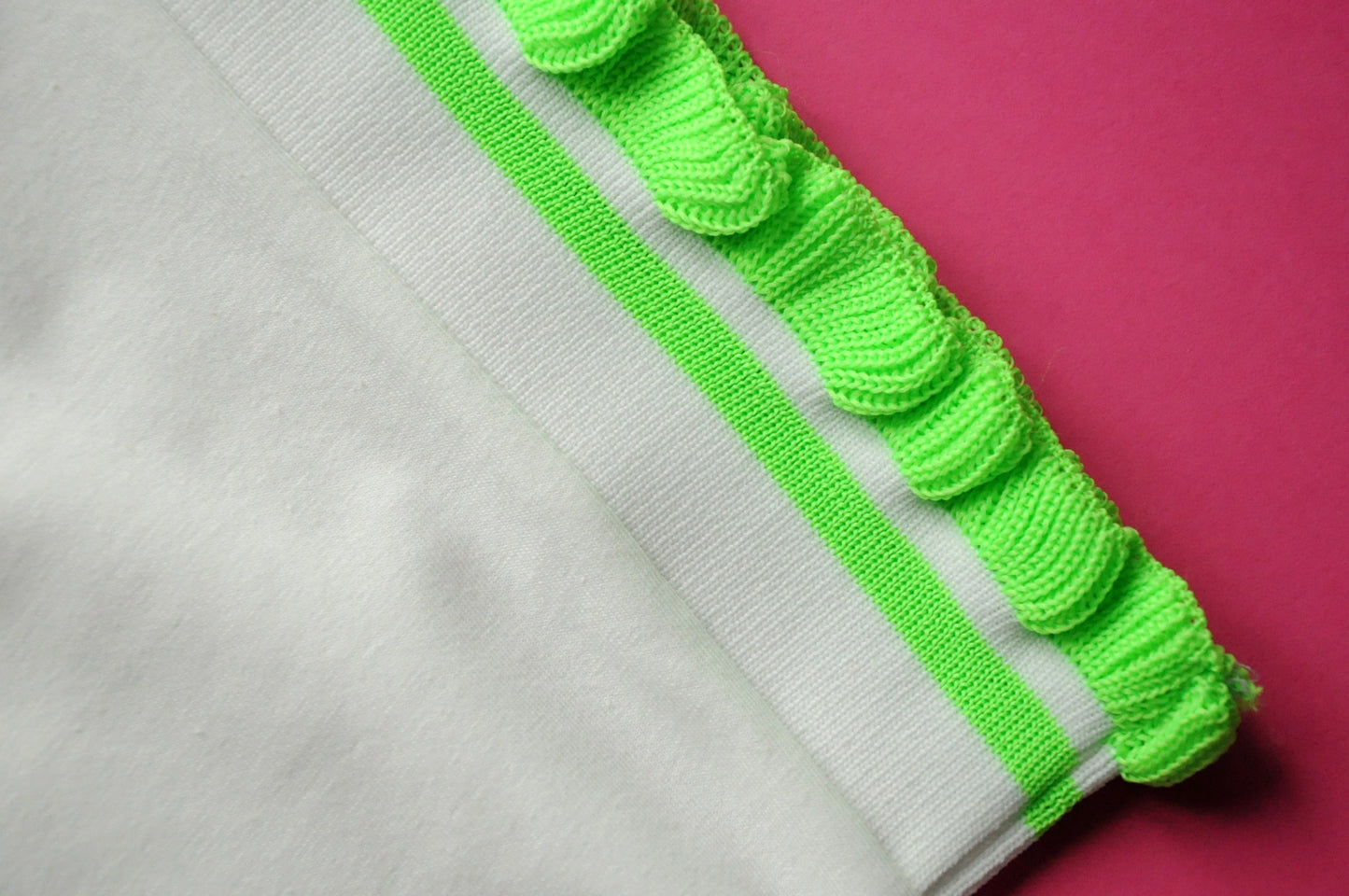 Cream soft cotton tee with extreme knit frill neon green sleeves