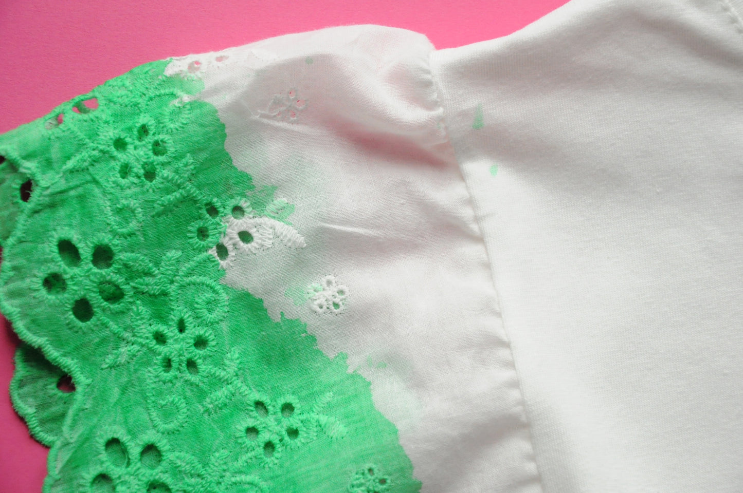 White straight-cut t-shirt with brocade green heart detail and frilled sleeves