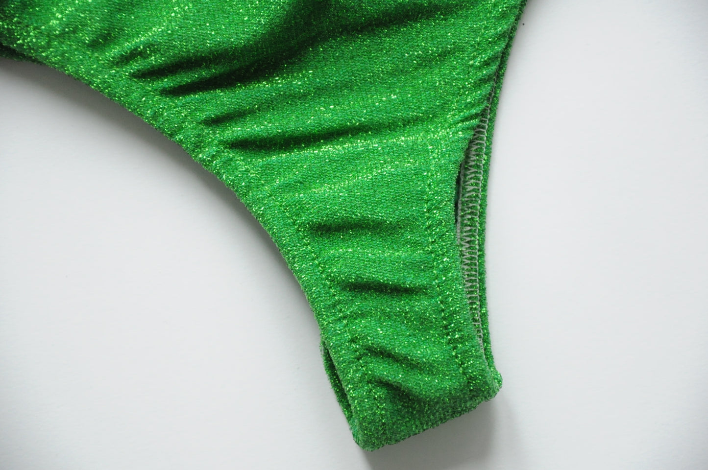 Green glittering bodysuit with deep open back